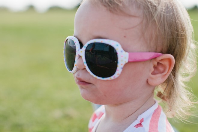 Flying a kite with the kids on a sunny Sunday afternoon